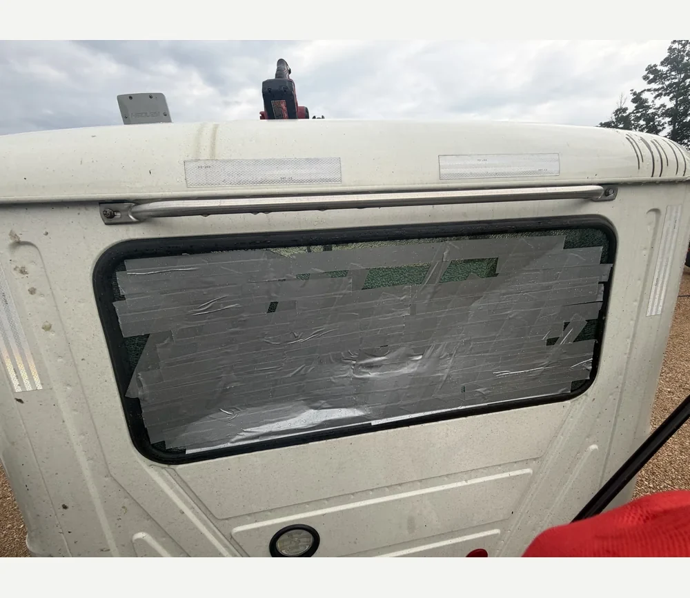 Truck cab rear window. Damaged rear window.